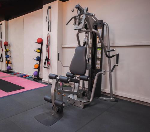 a gym with a elliptical machine in a room at Casa D'or Hotel in Beirut