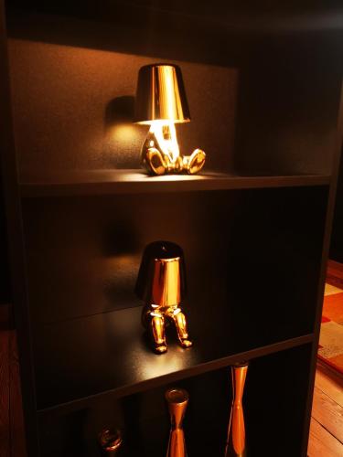 a cabinet with two lamps on top of it at Le Boudoir in Lyon
