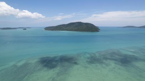 an island in the middle of a large body of water at Selina Serenity Rawai Phuket in Rawai Beach