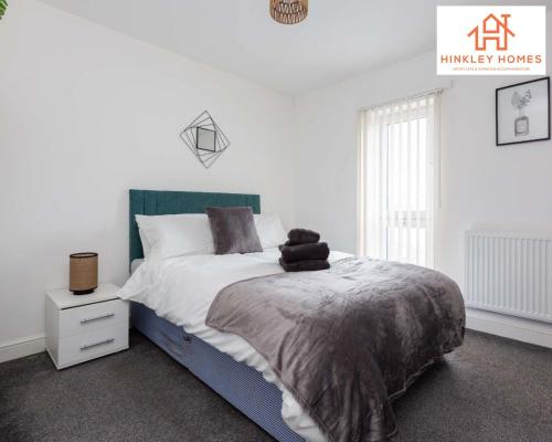 a white bedroom with a bed with a green headboard at Modern Townhouse - Free Gated Parking - City Centre - 5 ! By Hinkley Homes Short Lets & Serviced Accommodation in Liverpool