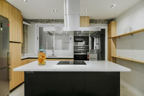 Kuchyňa alebo kuchynka v ubytovaní Six Apartments by Caleta Homes