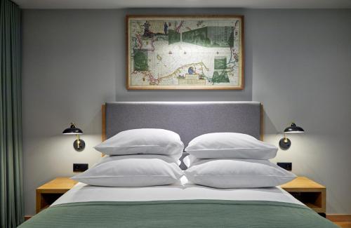 Łóżko lub łóżka w pokoju w obiekcie PURO Gdańsk Stare Miasto