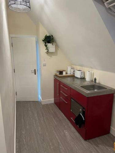 a kitchen with a sink and a counter top at 8 Studio, cosy loft, 50m to Airbus, bus-stop 20m, in Bristol