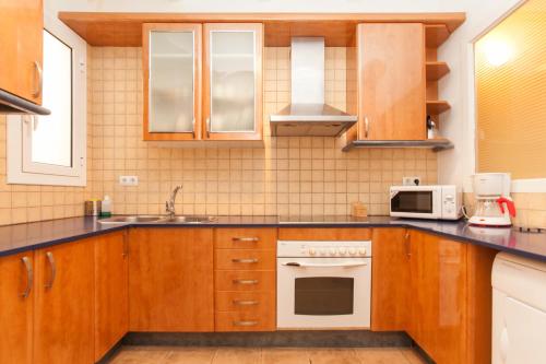 Majoituspaikan Apartment Aptucat keittiö tai keittotila