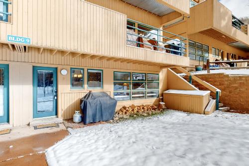 a building with snow on the ground in front of it at Revitalize in Vail in Vail