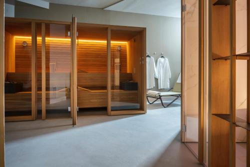 a wardrobe with wooden doors in a room at Perugia Park Hotel in Perugia