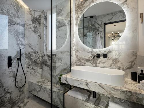 A bathroom at Riviera Suites
