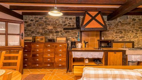 a kitchen with a counter and a sink in a room at Casa rural con encanto en Potes by Alterhome in Potes