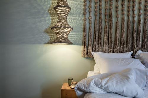 Ένα ή περισσότερα κρεβάτια σε δωμάτιο στο Macrame Luxury Suites