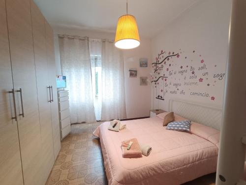 Letto o letti in una camera di Le Palme 98 "Casa Vacanze"