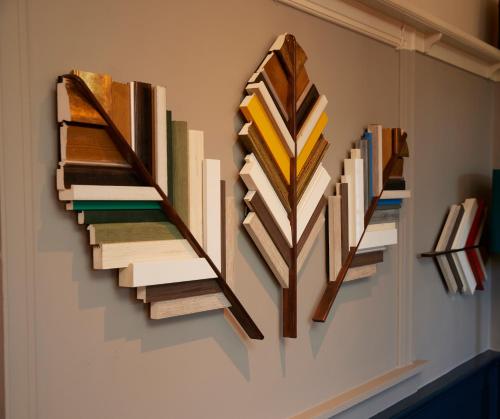 a group of books hanging on a wall at Feathers by Chef & Brewer Collection in Wadesmill