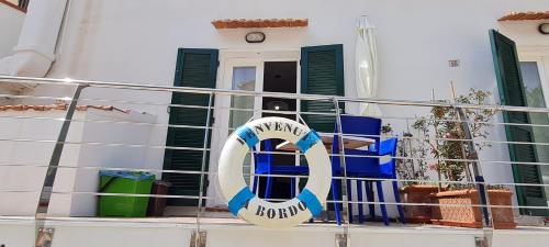 a life preserver on a balcony of a house at Casa Pomonte in Pomonte