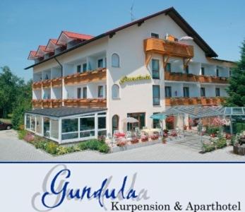 a picture of a large hotel with the words guillinveltveltveltination at Kurpension Gundula in Bad Füssing