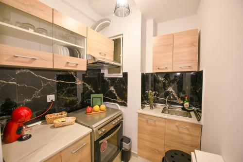 Η κουζίνα ή μικρή κουζίνα στο Modern, comfortable apartment, in the heart of the city_2