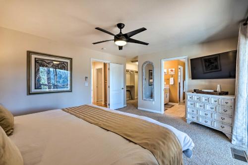 a bedroom with a bed and a ceiling fan at Pollock Pines Mums Retreat with Large Deck! in Pollock Pines