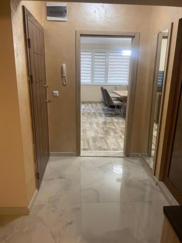 a hallway leading to a dining room with a table at apartment Mia in Yambol