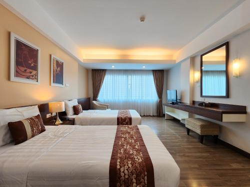 Postel nebo postele na pokoji v ubytování Avion Hotel