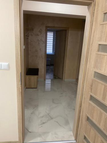 an empty room with a door and a hallway at apartment Mia in Yambol