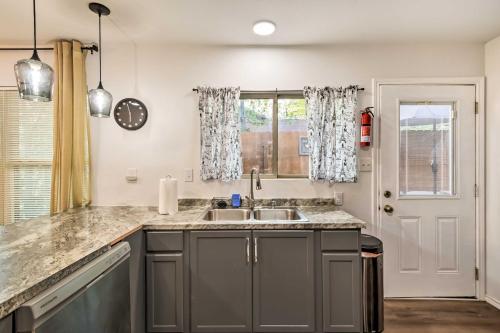 a kitchen with a sink and a window at Lovely Historic Fort Worth Home about 6 Mi to Dtwn! in Fort Worth