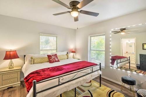 a bedroom with a bed and a ceiling fan at Lovely Historic Fort Worth Home about 6 Mi to Dtwn! in Fort Worth