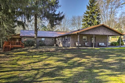 a house with a large yard in front of it at Near Mines and Meadows Spacious Home with Game Room in Beaver Falls