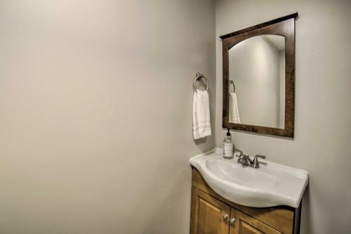 a bathroom with a sink and a mirror at Near Mines and Meadows Spacious Home with Game Room in Beaver Falls