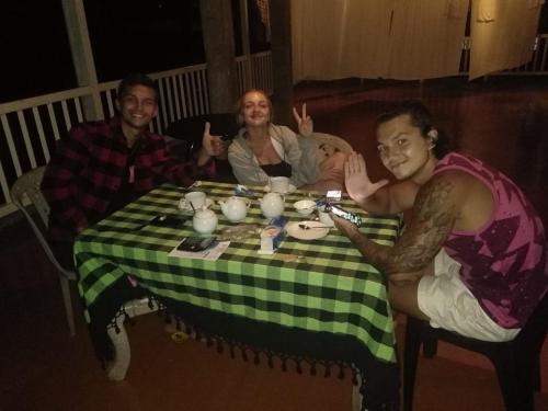 a group of people sitting around a table at Kandy City Village in Kandy