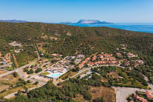 an aerial view of a resort near the ocean at Piccolo Hotel - Adults Only in Porto Ottiolu