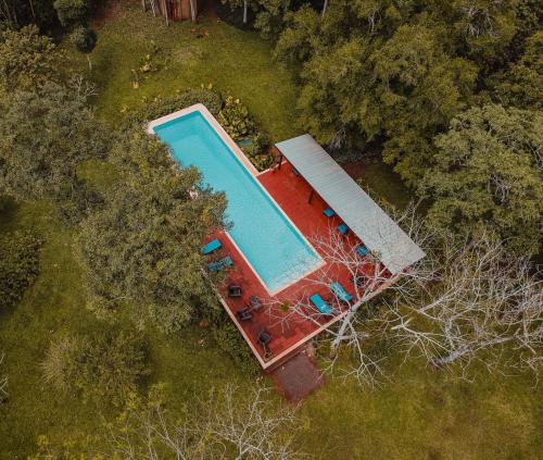 an overhead view of a swimming pool in a field at Reserva Natural Iguazú - Posada Puerto Bemberg in Puerto Libertad