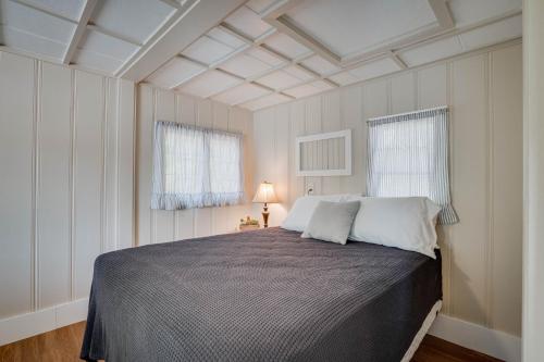 a bedroom with a large bed in a room at Lakeshore Fishing Cabins All 6 cabins in Lake Ozark