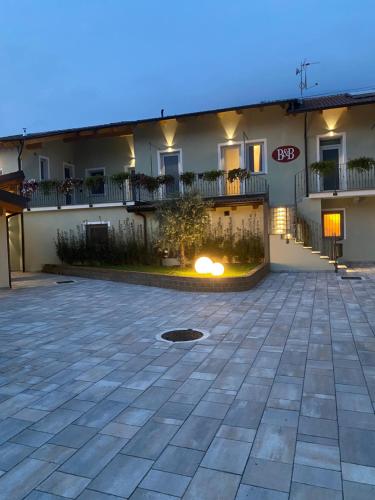 a large courtyard in front of a building at AFFITTACAMERE VAL SUSA in San Didero 