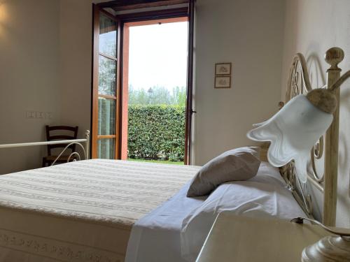 Postel nebo postele na pokoji v ubytování Valle del Metauro Country House