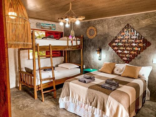 a bedroom with two bunk beds and a bed at Flats Macapá Meu Amor 4 in Luis Correia