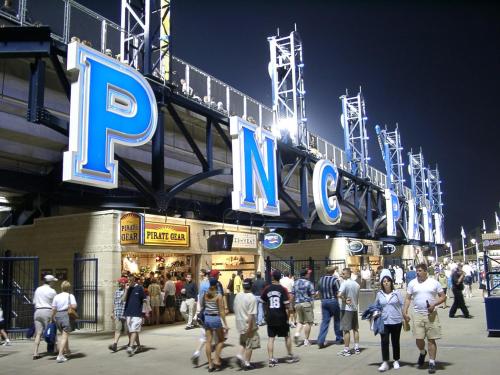 a group of people walking outside of a baseball stadium at Hotel Indigo Pittsburgh University - Oakland by IHG in Pittsburgh