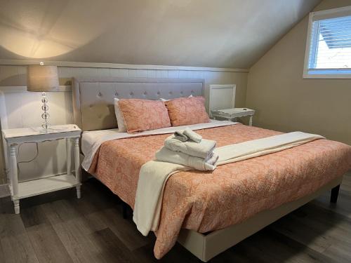 a bedroom with a large bed with two night stands at Finding Tranquility in Colorado Springs
