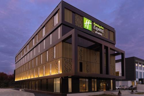 a building with a sign on the side of it at Holiday Inn Express & Suites - Deventer by IHG in Deventer