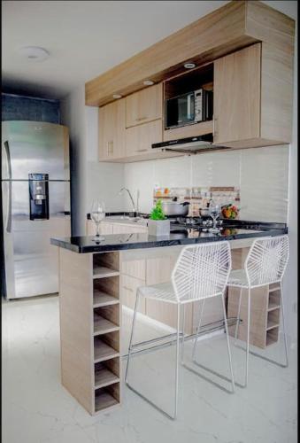 Una cocina o zona de cocina en Beautiful and peaceful apartment, place to relax.