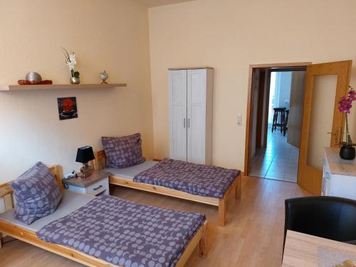 a living room with two beds and a couch at Wacker in Plauen
