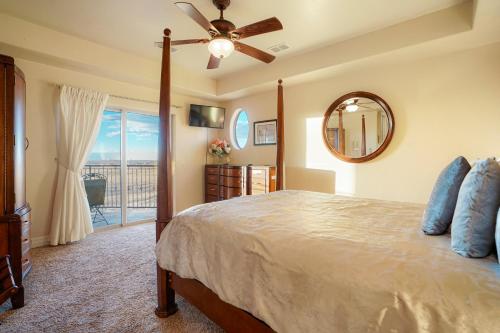 a bedroom with a bed and a ceiling fan at Summit Villa BnB in Watkins