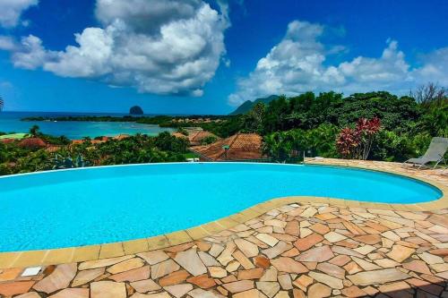 Het zwembad bij of vlak bij Villa Aloes: Vue mer et calme à 2 pas de la plage