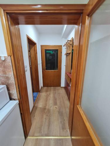 a hallway leading into a room with a door at Apartman's Ana Pale-OC Jahorina No.2 in Pale