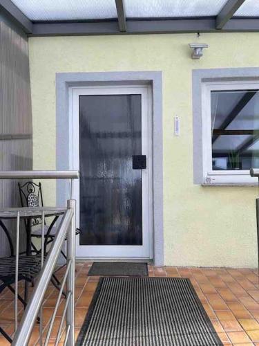 a front door of a house with a window at Schöne Eigentumswohnung optional mit Sauna Nutzung in Villingen-Schwenningen