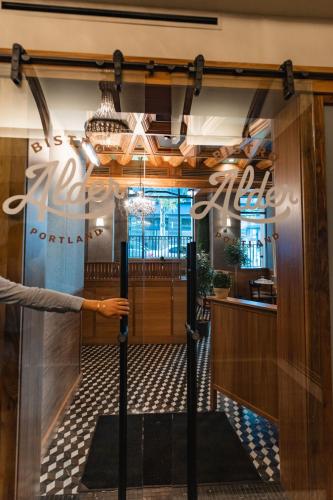 a view of the front door of a restaurant at Dossier in Portland