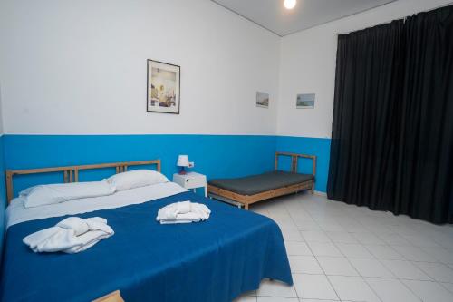 מיטה או מיטות בחדר ב-Flyresidence Garibaldi