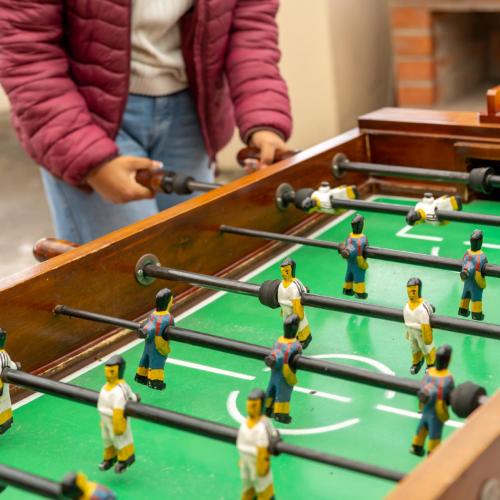 a group of lego men playing a game of billiard at Mashy´s Hostal in Otavalo