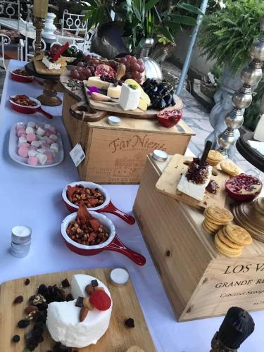 a table topped with lots of different types of food at La Casita Inn Bustamante in Bustamante