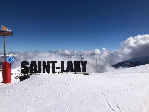 a sign that says sant lay in the snow at LA CANELA - Saint Lary Soulan -Pla d'Adet Ski in Saint-Lary-Soulan
