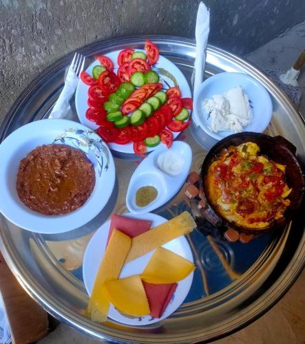 a plate of food with different types of food on it at Nile View Guest House in Aswan