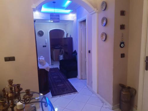 a living room with a hallway with a blue light at Appartement au Coeur de Casablanca in Casablanca