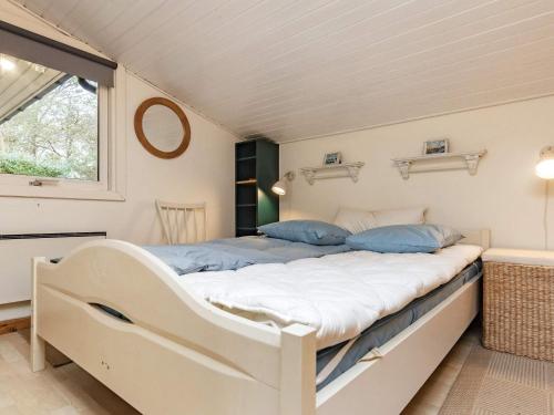 A bed or beds in a room at Holiday home Haarby IV